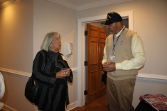 BCHH-Open-House-Elton-Wright-talks-with-guest-about-Veterans-Program