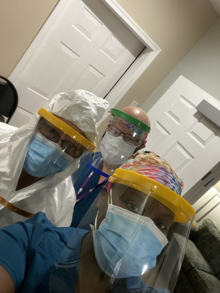 Nurses and Certified Nursing Assistants wear personal protective equipment before caring for patients at Hospice of the Chesapeake's Mandrin Inpatient Care Center in Harwood, Maryland. 