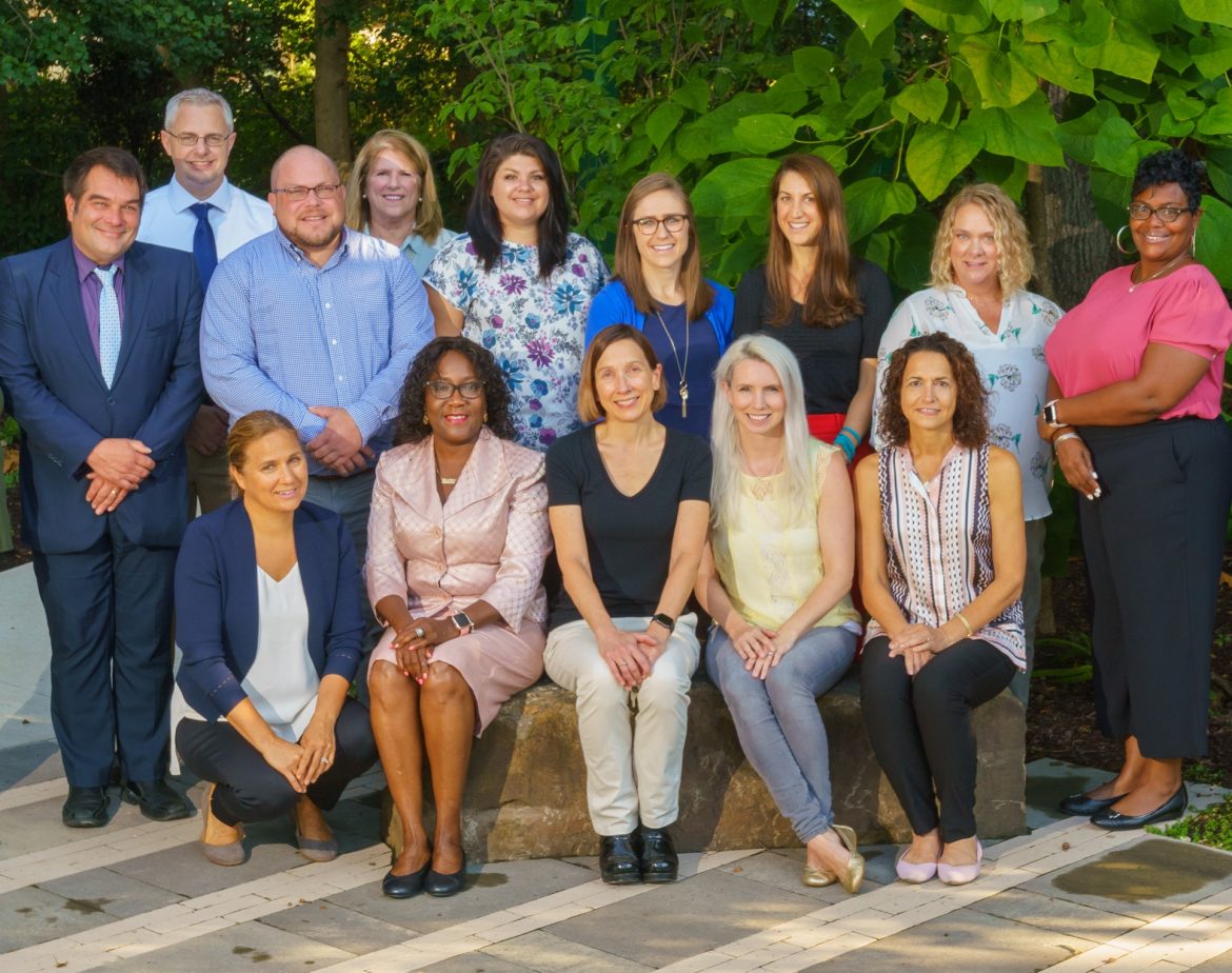 The Chesapeake Supportive Care Team poses in the Children's Memorial Garden on the Hospice of the Chesapeake John & Cathy Belcher Campus