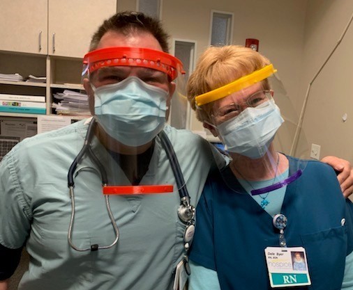 Chief Medical Officer Dr Eric Bush and Dale Byer, RN, don personal protective equipment while working in the Rebecca Fortney Inpatient Care Center on the John & Cathy Belcher Campus of Hospice of the Chesapeake in Pasadena, Maryland.