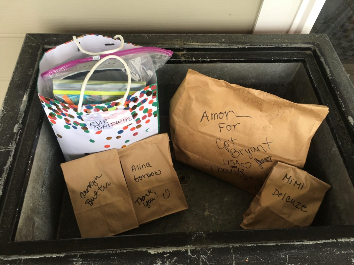 Packages for Face Masks for Maryland team members sit in an antique Coca Cola cooler on Lucy Kruse porch. 