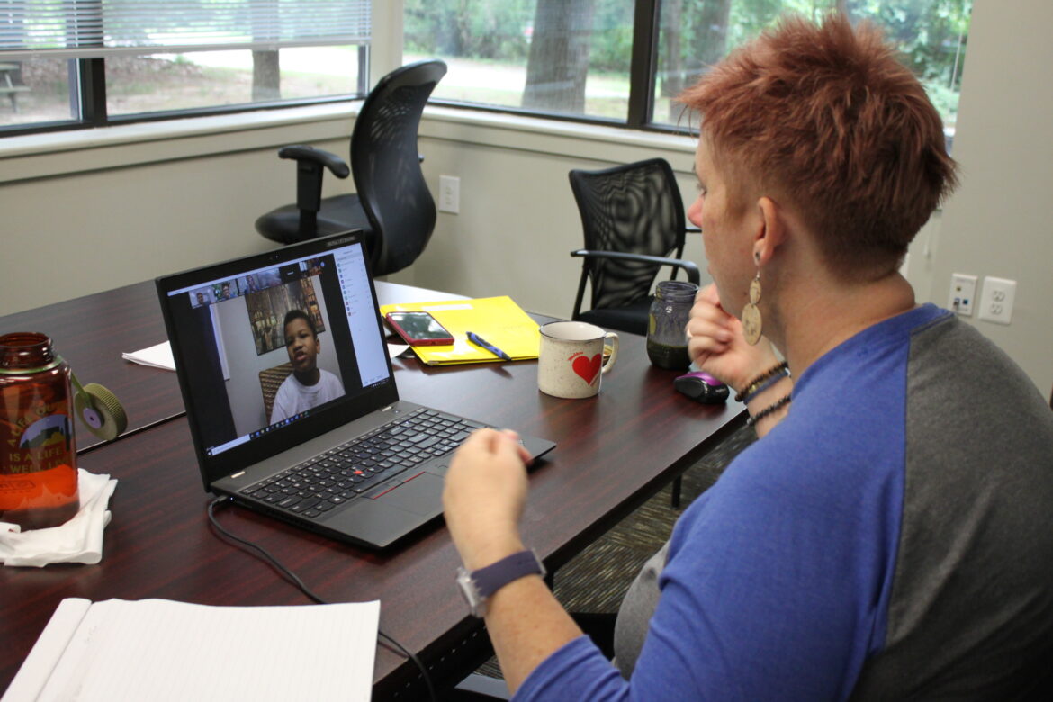 Chesapeake Life Center Bereavement Services Manager Amy Stapleton plays a game of charades with camper Jyair Levenberry during the second day of Grief Burst 2020!, a virtual grief camp held in August. 