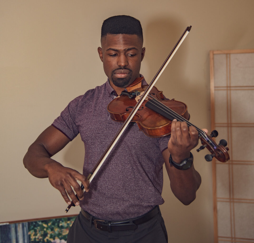 Certified Therapeutic Musician Alex Strachan plays the violin at Hospice of the Chesapeake
