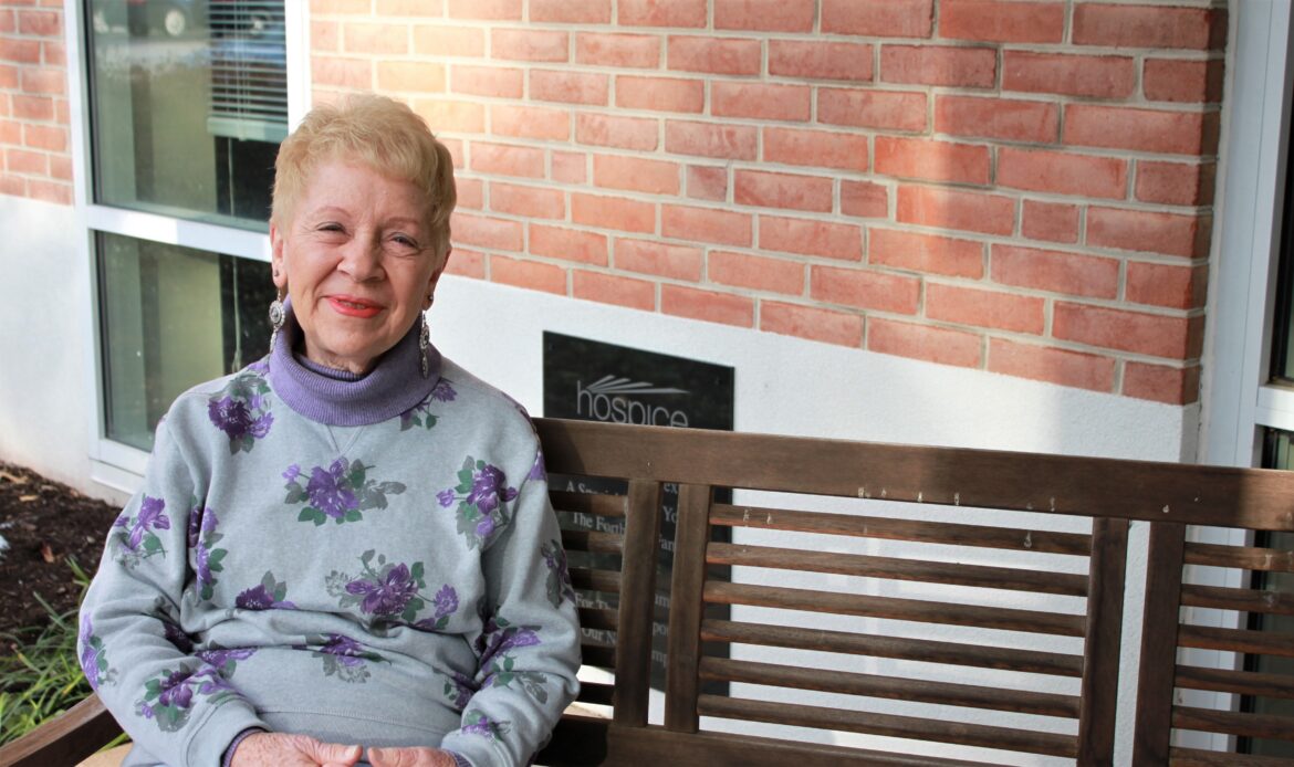 Gloria Kinsley poses outside of the Hospice of the Chesapeake offices in Pasadena, Maryland, in 2019. She is one of the organizations companionship caller volunteers