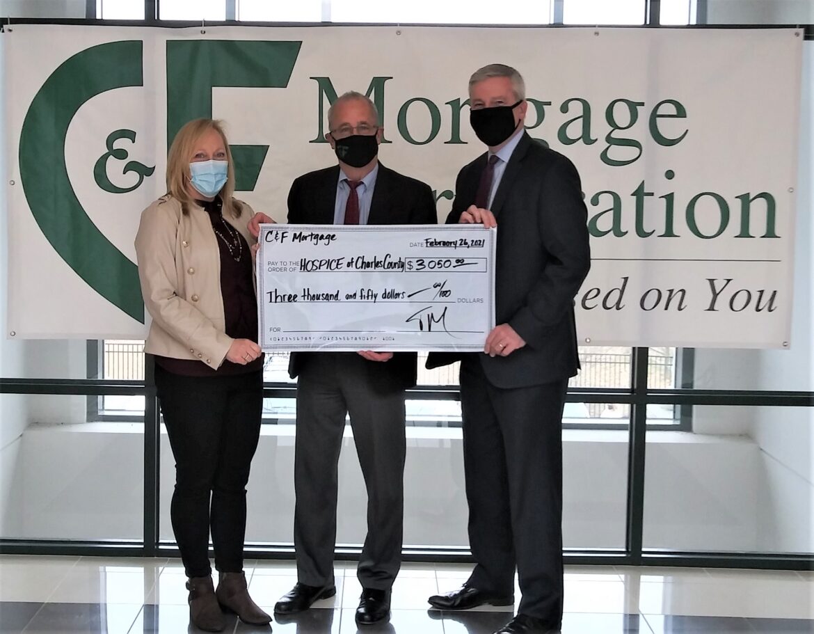 C & F Mortgage Corporation Waldorf Branch Manager Tim Murphy, center, presents a check for $3,050 to Hospice of Charles County, a Hospice of the Chesapeake affiliate. The nonprofit’s Director of Advancement and Volunteer Services Chris Wilson, left, and President and CEO Mike Brady, right, accept the donation with gratitude.