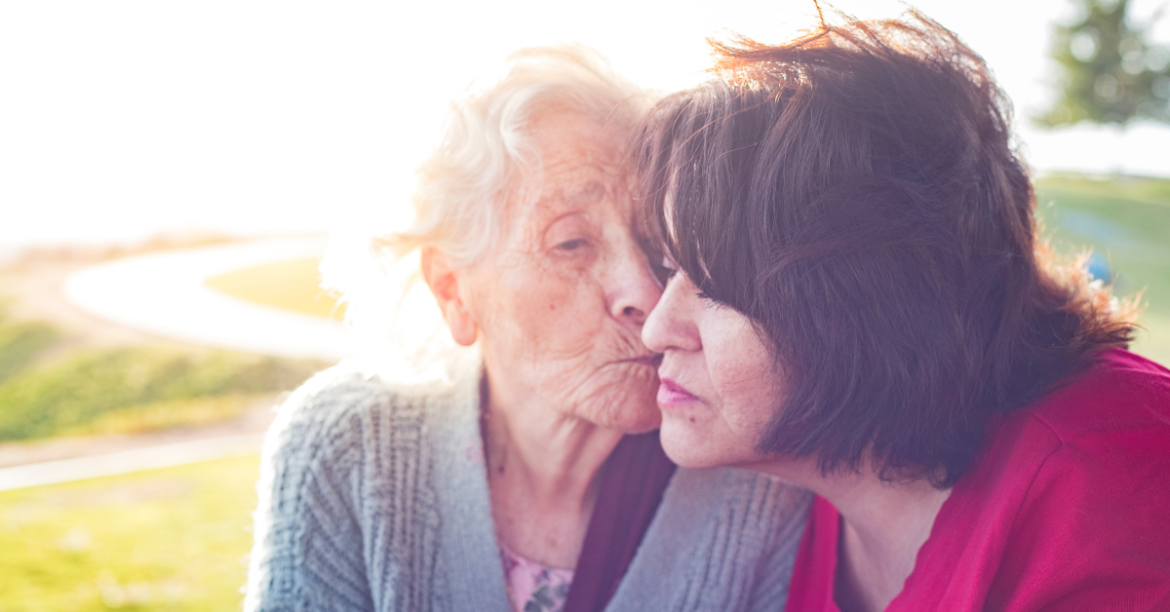 Caregivers support group photo shows elderly woman with another woman
