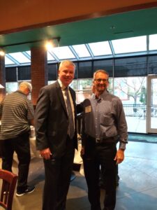 (Oct. 13, 2021) Hospice of the Chesapeake CEO Mike Brady, left, greets E. Larry Sanders of ELS Insurance at the Rotary Club of Charles County (La Plata) weekly breakfast meeting at the Greene Turtle in La Plata, Maryland. Courtesy photo