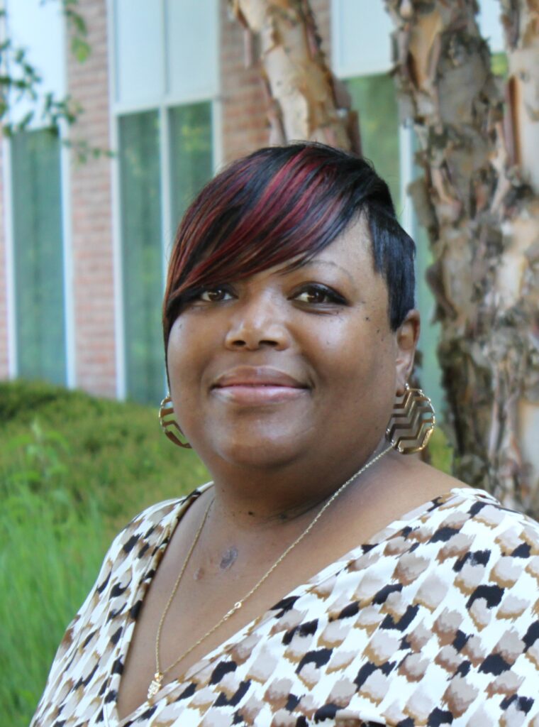 A headshot of Volunteer Services Coordinator LaShan Ross, who is being mentored by longtime volunteer Joan Blum.