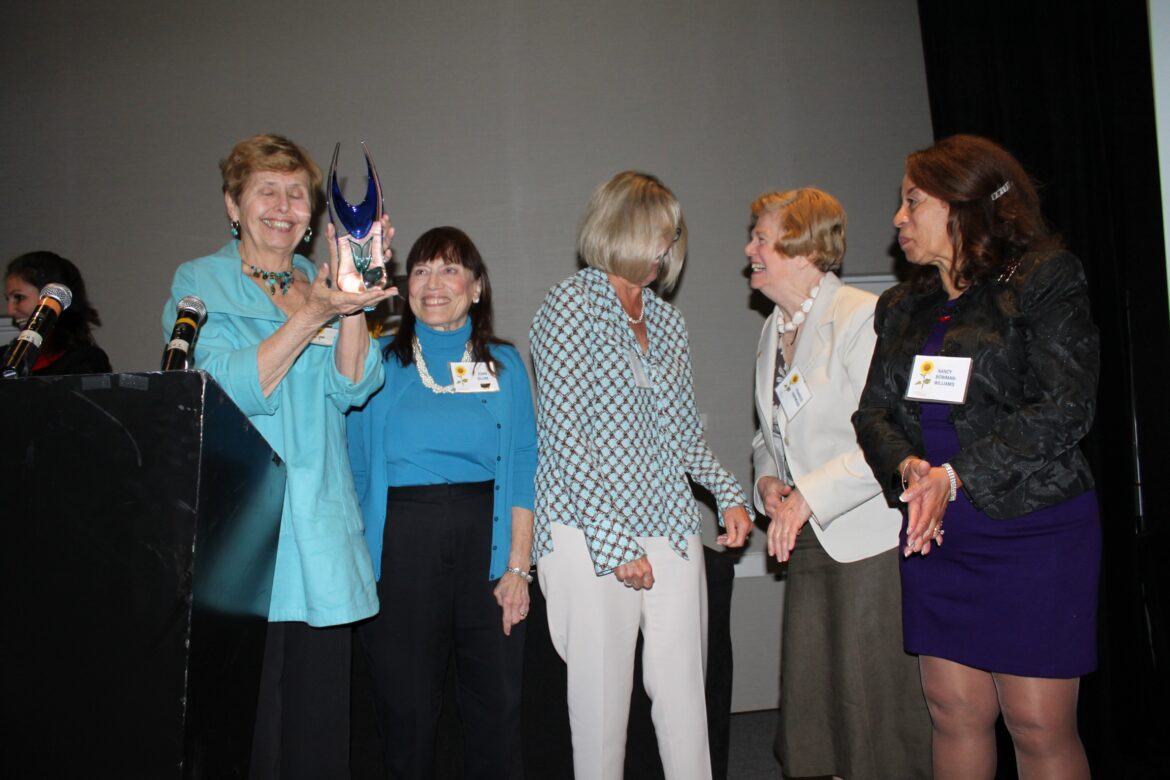 Longtime volunteer Joan Blum, second from the left, joins the 2017 Tuck-In Team to receive the Spirit Award at a Volunteer Awards luncheon. Her nearly three decades of volunteering will be a great resource for the volunteers she mentors.