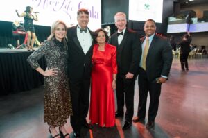 Posing on the dance floor, from left, are State Senators Dawn Giles, Guy Guzzone and Pam Beidle, President and CEO Mike Brady and Anne Arundel County Councilman Pete Smith.