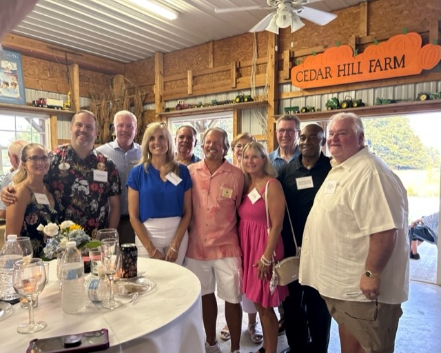 From left are Liz and Chris Wooters, Hospice of the Chesapeake President and CEO Mike Brady, LaPlata Mayor Jeannine James, Art Payton, Andy Anderson, Susanne Payton, Vera Wheeler, former State Senator Mac Middleton, State Senator Michael Jackson and Bud Humbert at Cedar Hill Farm in Waldorf, Maryland. 