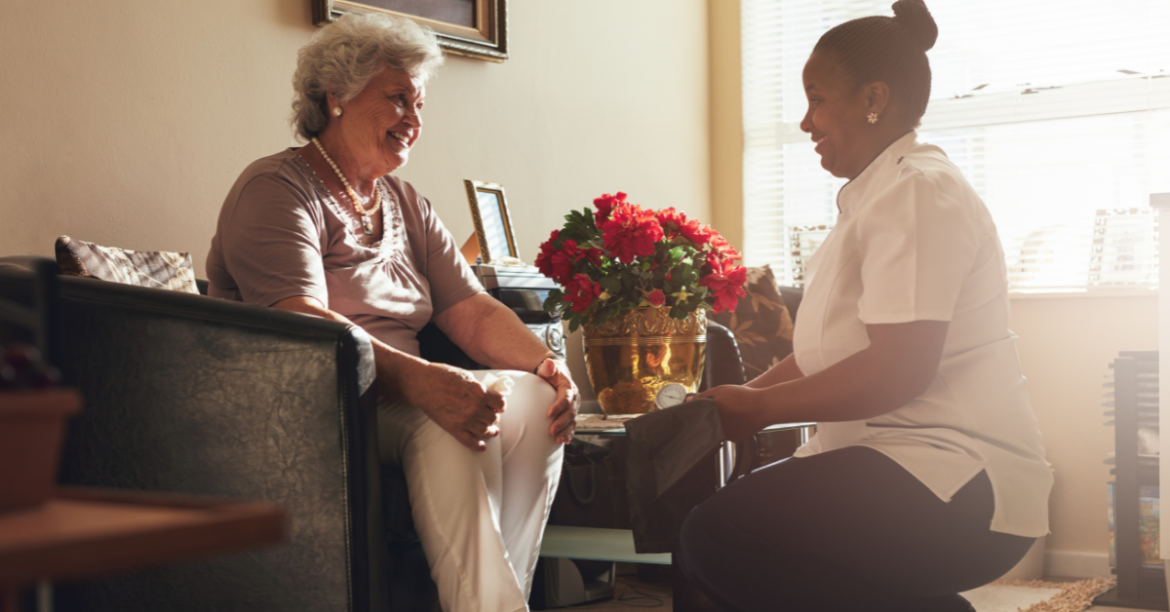 Hospice nurse visiting patient in their home