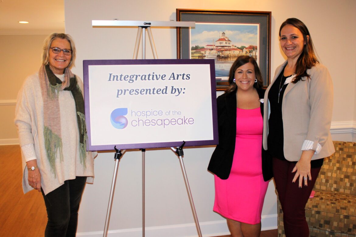 End-of-Life Doula Teri Gibbons-Jacobson stands with Integrative Arts Manager Alena Dailey and Volunteer Services Manager Heather Conner outside of a room offering integrative arts demonstrations at Calvert County's Burnett Center for Hope & Healing.