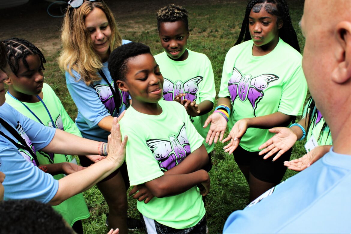 Campers and counselors take part in a trust activity at Chesapeake Life Center’s Camp Nabi held at Arlington Echo Outdoor Education Center in Millersville, Maryland.