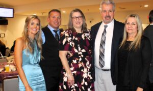 Hospice of the Chesapeake President and CEO Becky Miller, center, poses with, from left, Brittany, Bill, Roger and Diane Murphy from the events Presenting Sponsor, Floor Systems. Photo by Nicolette Bowman