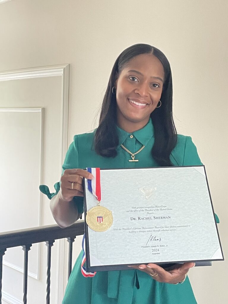 Rachel Sherman holds her Presidential Lifetime Achievement Award she received June 19 at Black Excellence Networking and Awards Event in Bowie, Maryland.